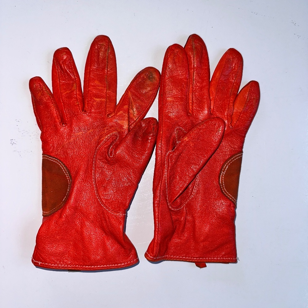 Red leather gloves.